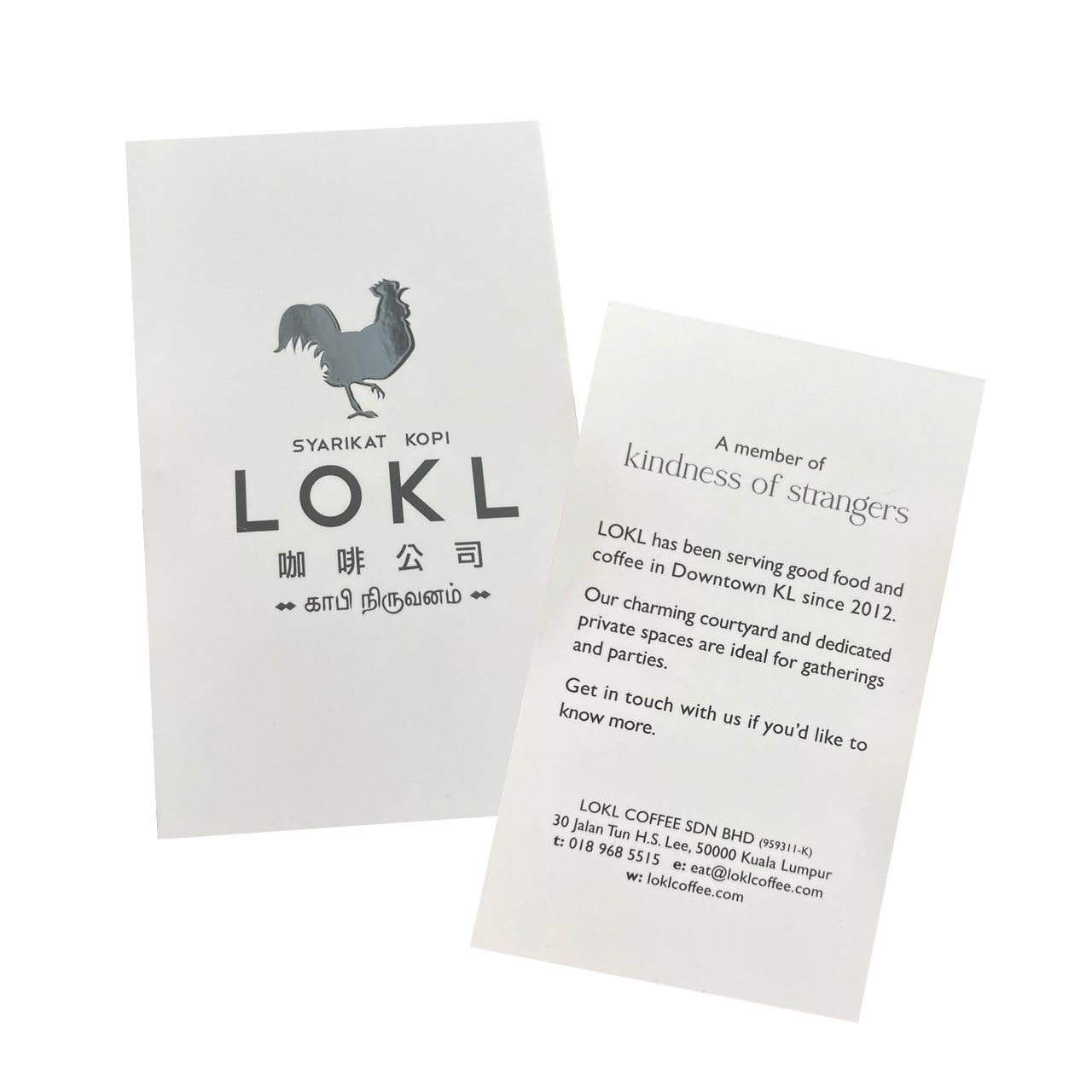 custom Business cards for coffee shop on a white background, one with a rooster logo in spot uv on a matte card