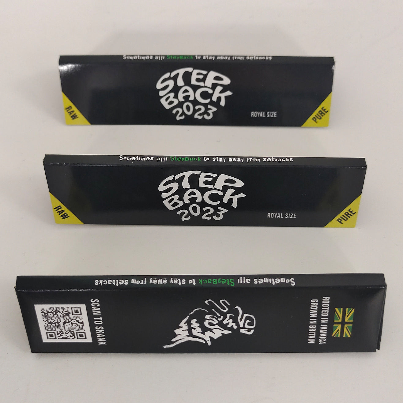 Custom rolling paper printed booklets with 'Step Back 2023' branding for music artist reek0.
